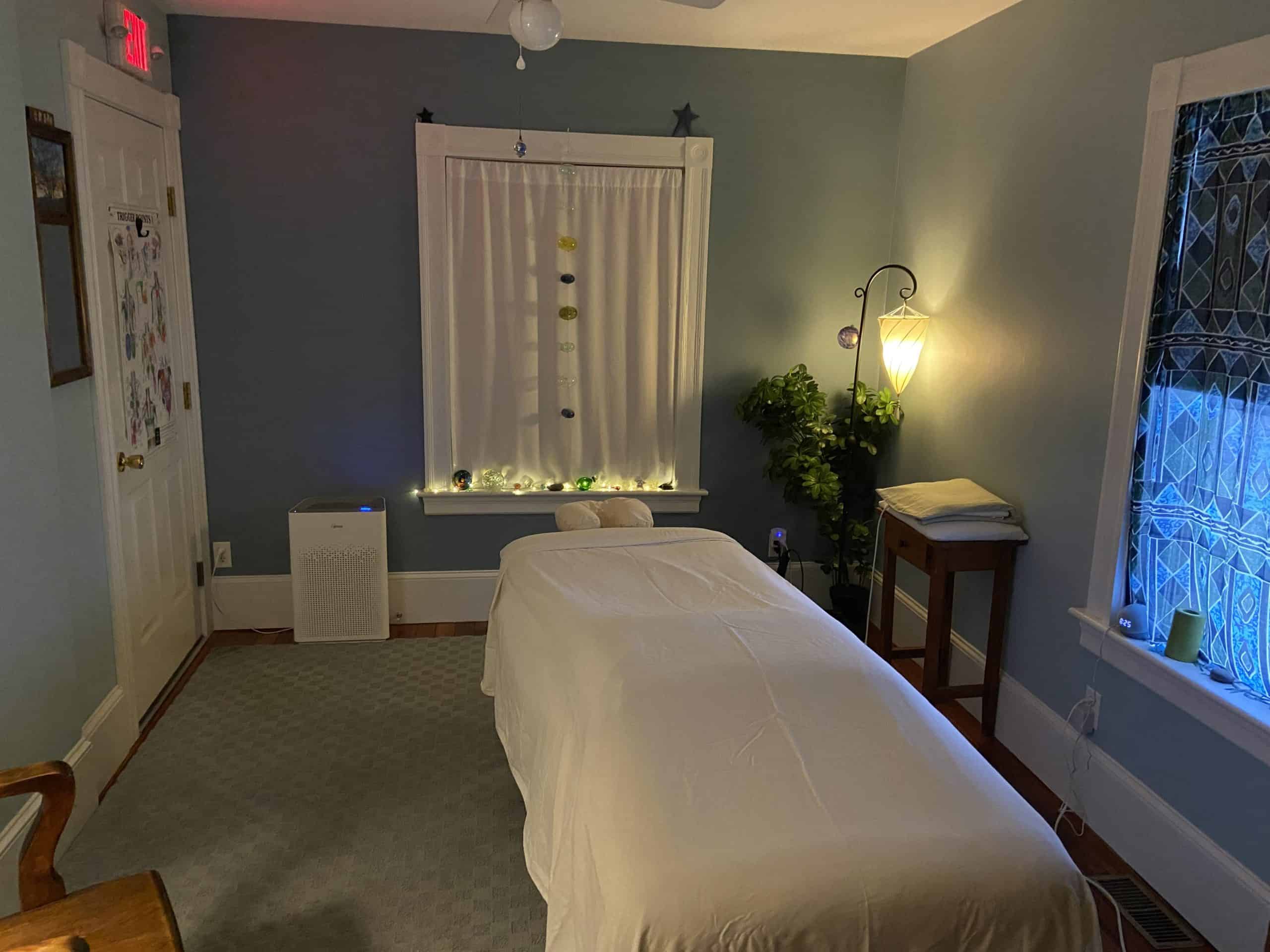 Healing Zone Massage treatment room with dim lighting for relaxation